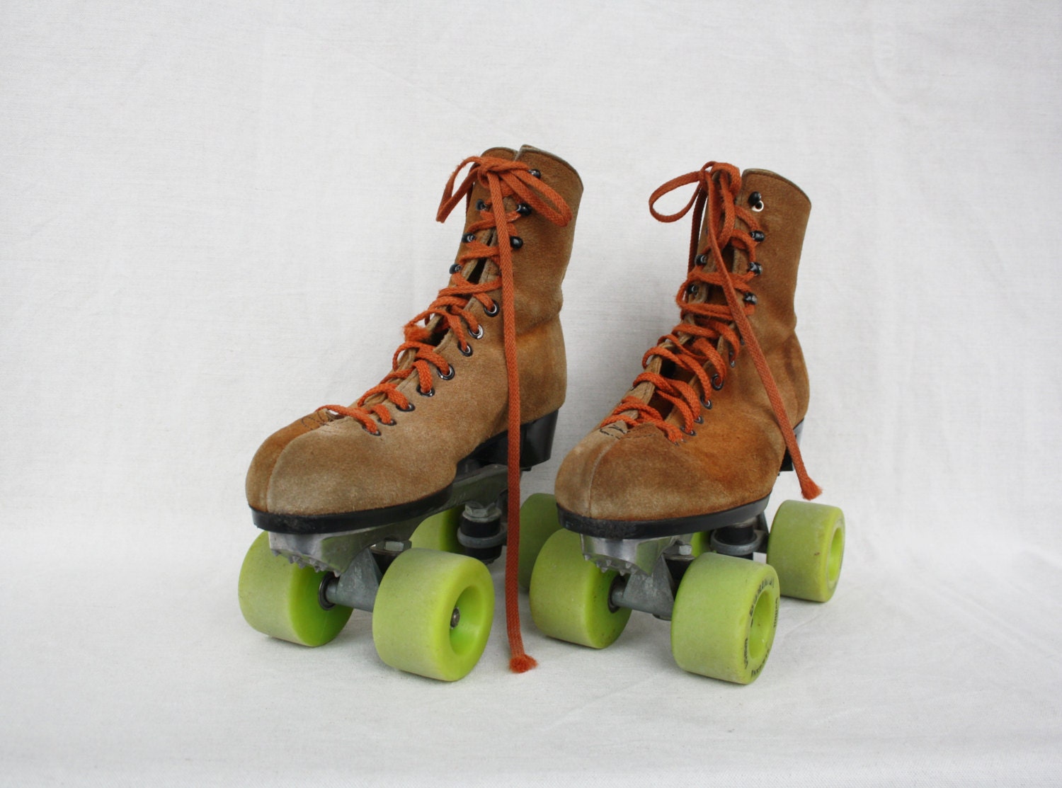 Roller skate brown suede skates with bright green wheels