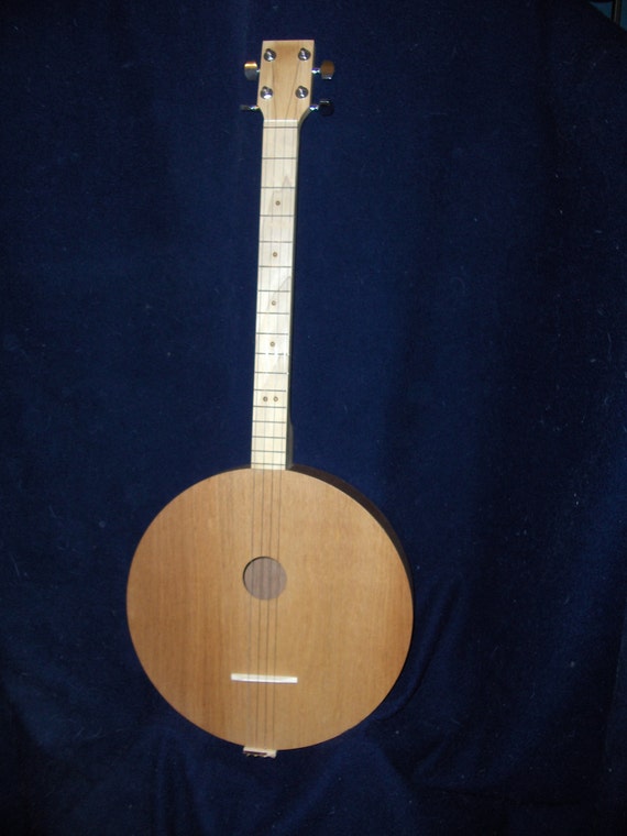 Four stringed round guitar