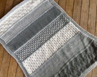 Baby blanket in white and shades of gray