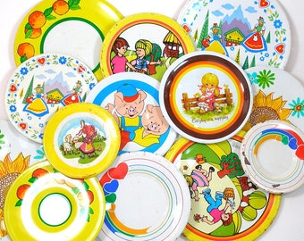 13 Tin Toy tea saucers in yellows, 1960s graphics, Instant Collection.