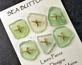 A set of six cute little double drilled sea foam green sea glass buttons from Maine