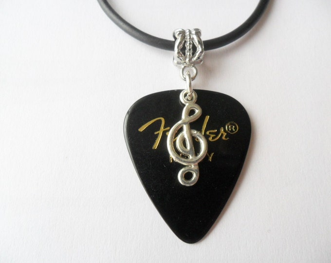 Black Guitar pick necklace with treble clef music note that is adjustable from 18" to 20"