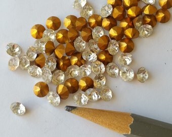 12 Swarovski clear crystal rhinestone chatons with gold foil. 5mm
