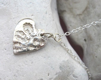 Fine silver and sterling silver heart necklace with lace petal imprint