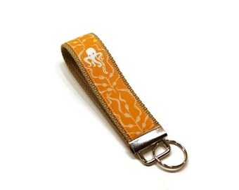 Sealife (octopus and seahorse) fabric wrist key fob key chain wristlet. Orange.