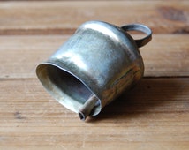 Image result for little tin bell in casket