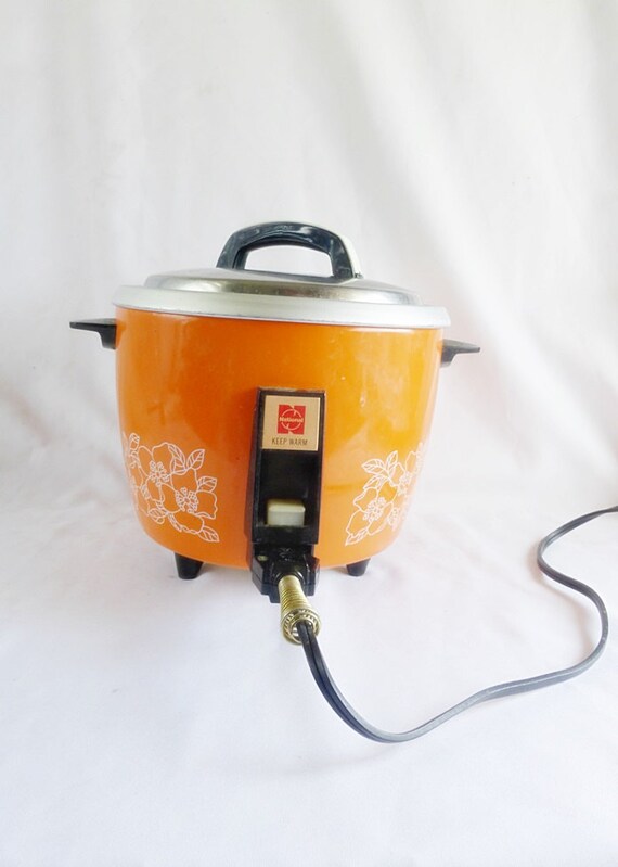 A Little Dented Up Bright Orange Vintage National Rice Cooker