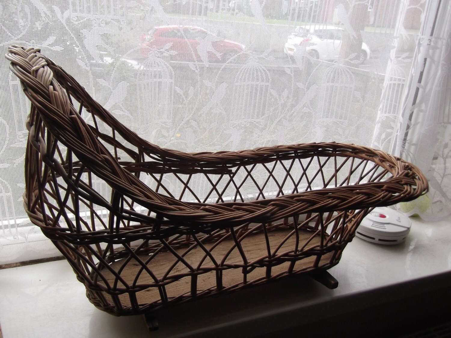 antique wicker doll's cradle