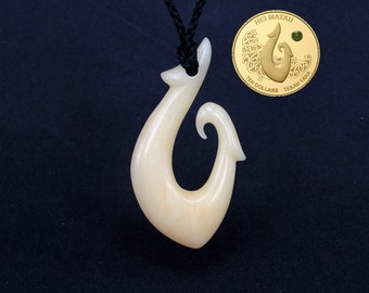 Items similar to Hand Carved Maori Hei Matau and Koru Cow Bone Pendant ...