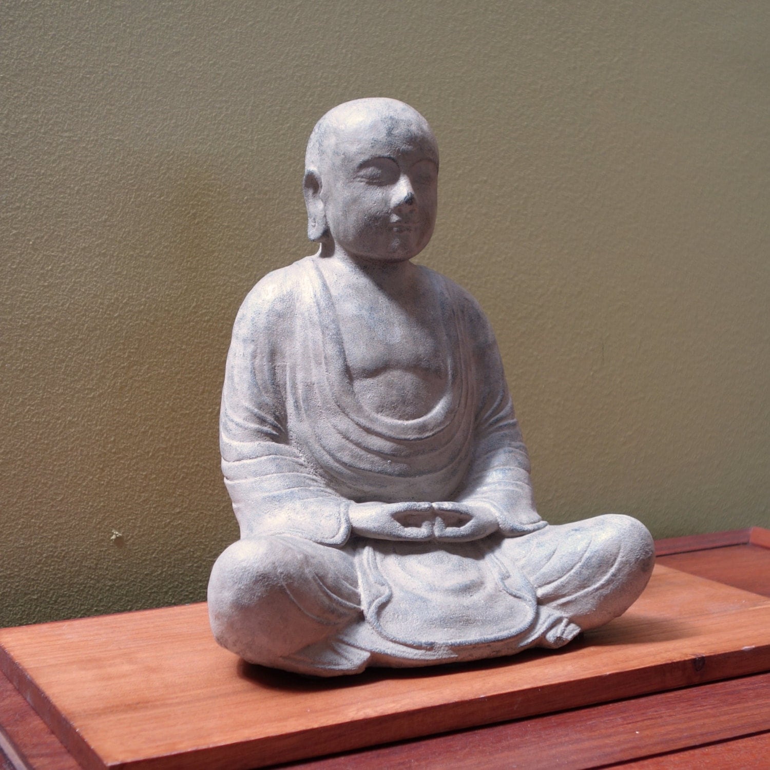 Monk statue made of volcanic ash. zen buddhism