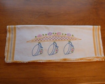 Vintage embroidered tea towel with crocheted edging