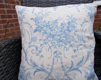 Blue floral cushion cover for 50cm pad. Natural linen with blue floral design. Natural/neutral cotton back with envelope closure.