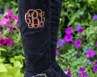 monogram plaque long leather boots