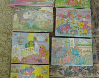 7 Vintage My Little Pony puzzles and a std. faded pillowcase