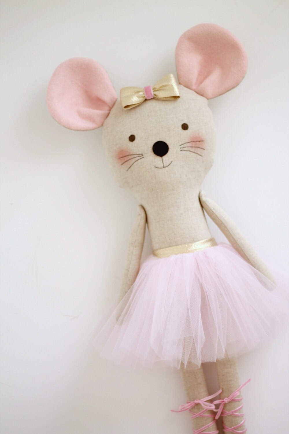 Mouse ballerina in a pink tutu and a golden bow. Stuffed