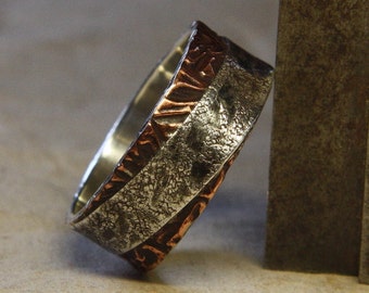 Two sides to every story. Mans ring of sterling silver and copper. Mans engagement ring.