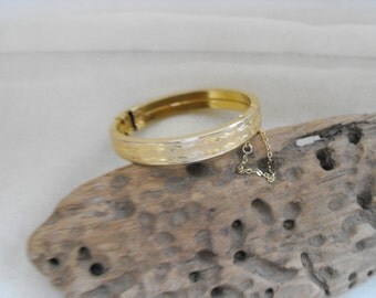Vintage goldtone bracelet with etched pattern and safety chain in a vintage box