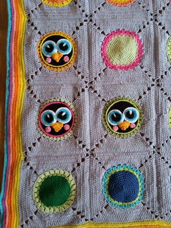 Crochet baby blanket with penguin motifs granny square
