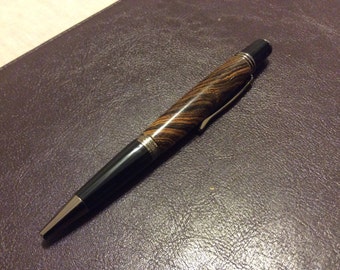 A maple burl twist ballpoint pen