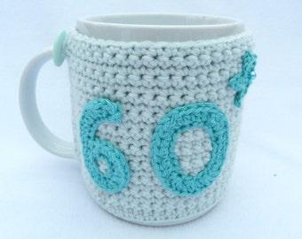 60th Birthday light turquoise crochet mug cozy. Homewares, birthday gift, accessories, 60th birthday gift