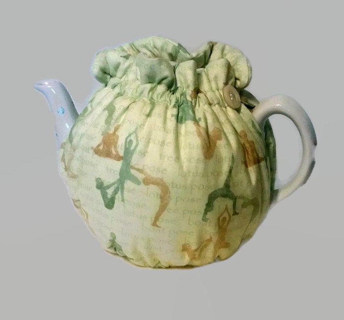Teapot Cozy tea warmer with yoga poses on light creamgreen