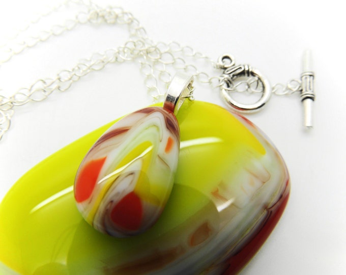 Green orange fused glass pebble necklace. Contemporary jewellery/jewelry. Modern colourful fashion accessories. Birthday anniversary gift