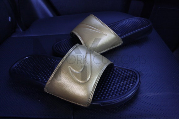 nike slippers black and gold