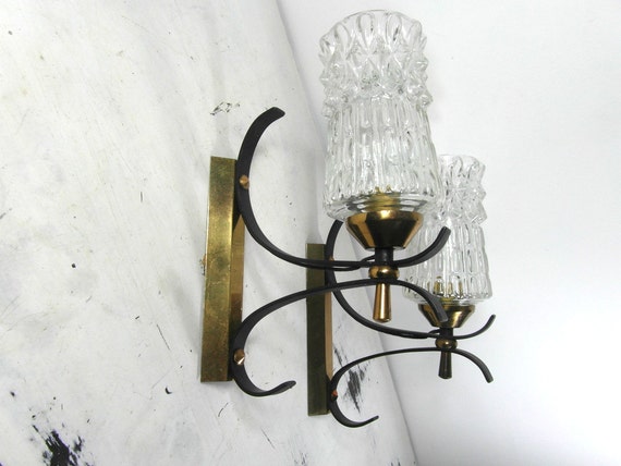 A pair of mid century wall sconces glass light shades gold