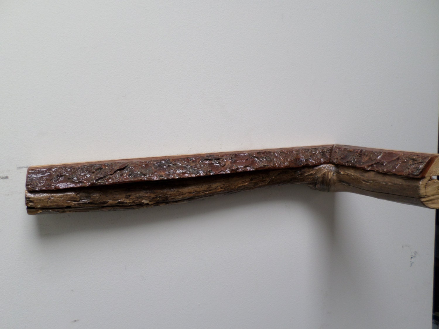Rustic live edge driftwood inside corner shelf