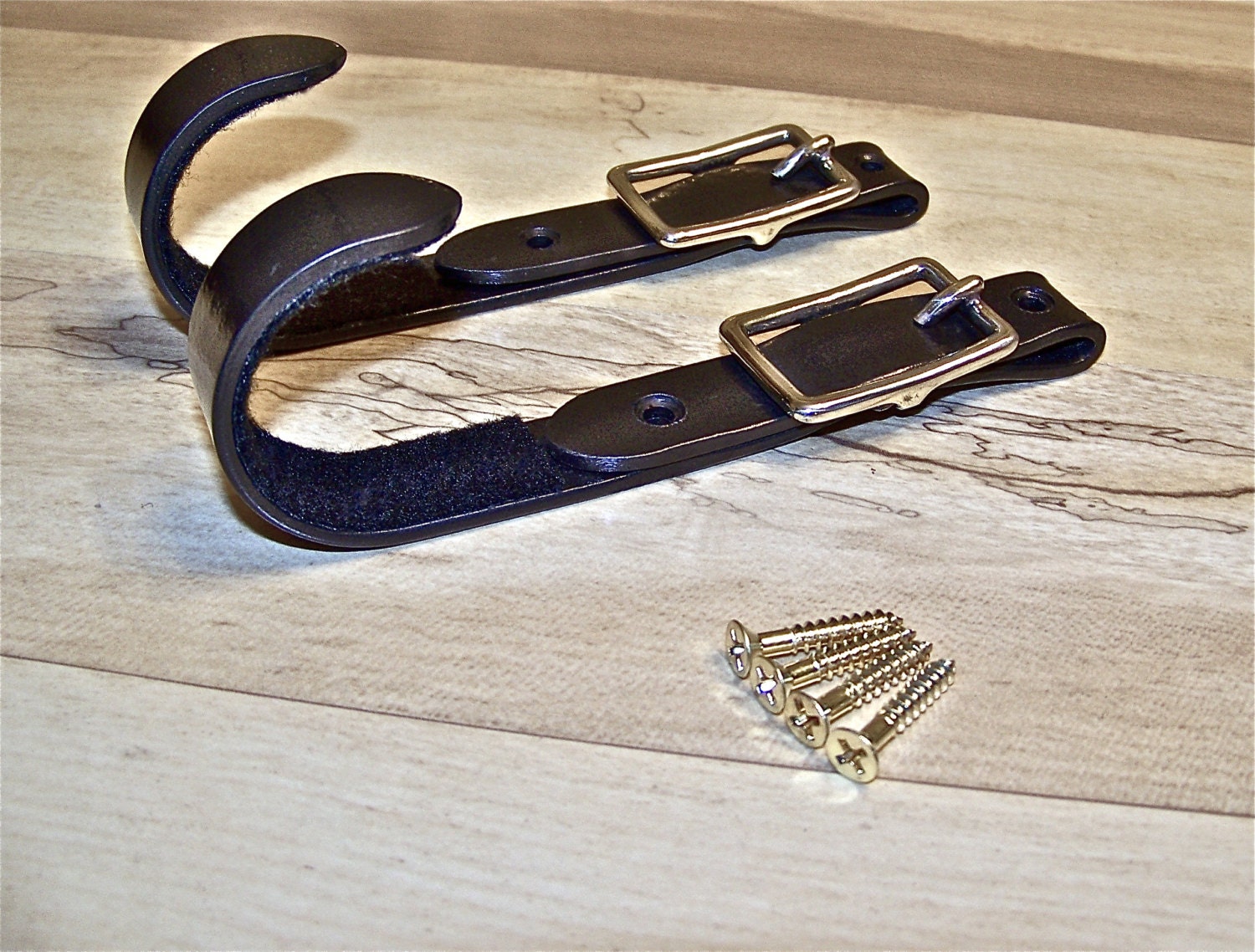 Blacksmith made Buckle Gun rack hangers by IronHorseBlackSmith