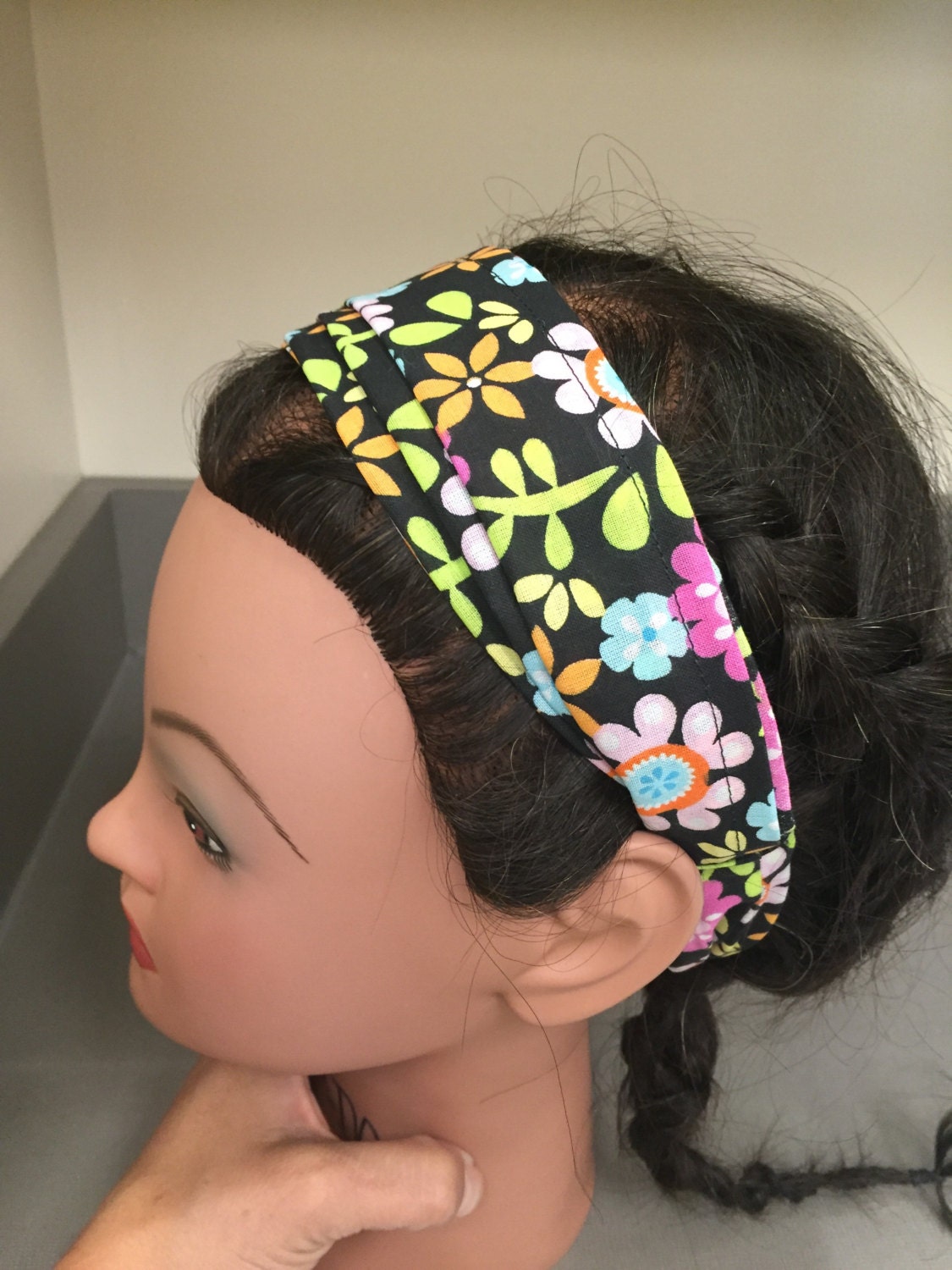 Download Expandable headband in a black with multiple colors of flowers