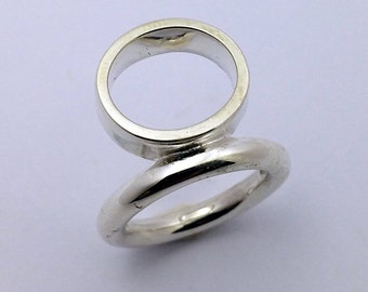 Items similar to triple orbit ring on Etsy