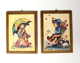 Retro prints of n. Clark & t. Jones on wood panel