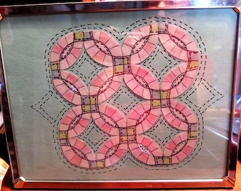 Double Wedding Ring quilt picture in frame.
