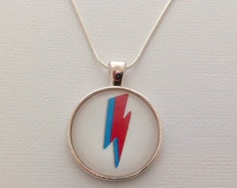 Tribute to David Bowie: Ziggy Stardust / Aladin Sane lightning under a glass dome- 25mm (1in)