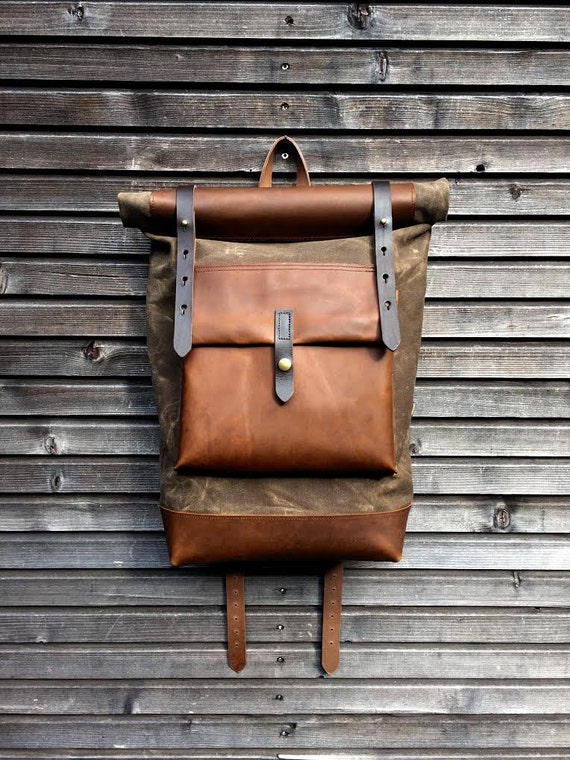 Waxed canvas backpack with roll up top and oiled leather