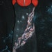 Size small, vivid orange and pink galaxy with glittery stars on a black cotton dress. beach festival summer stars cosmos