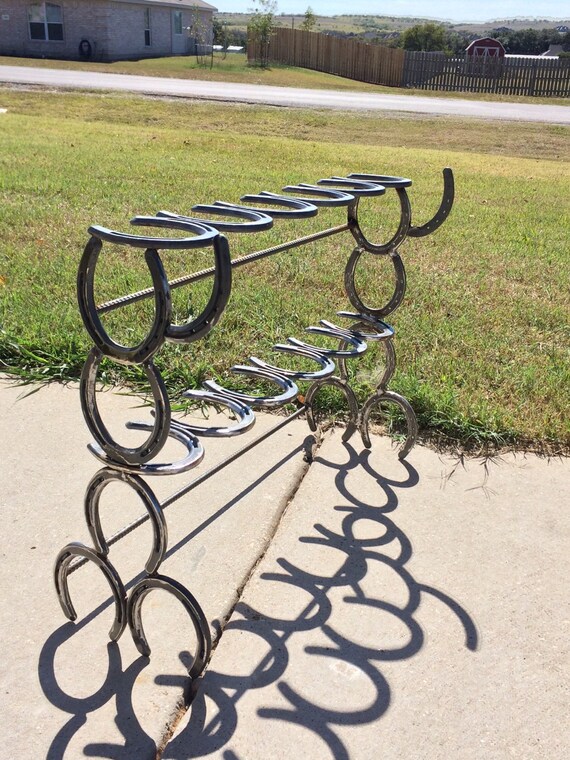 Rustic 6 pair horseshoe boot rack. With by FabricationsByBruce