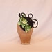 Unique handmade small black hat/fascinator with green orchid decoration
