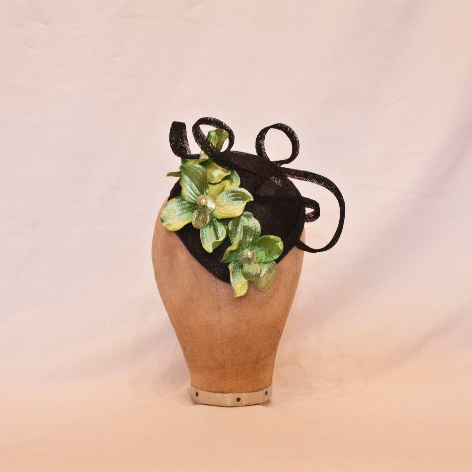 Unique handmade small black hat/fascinator with green orchid decoration