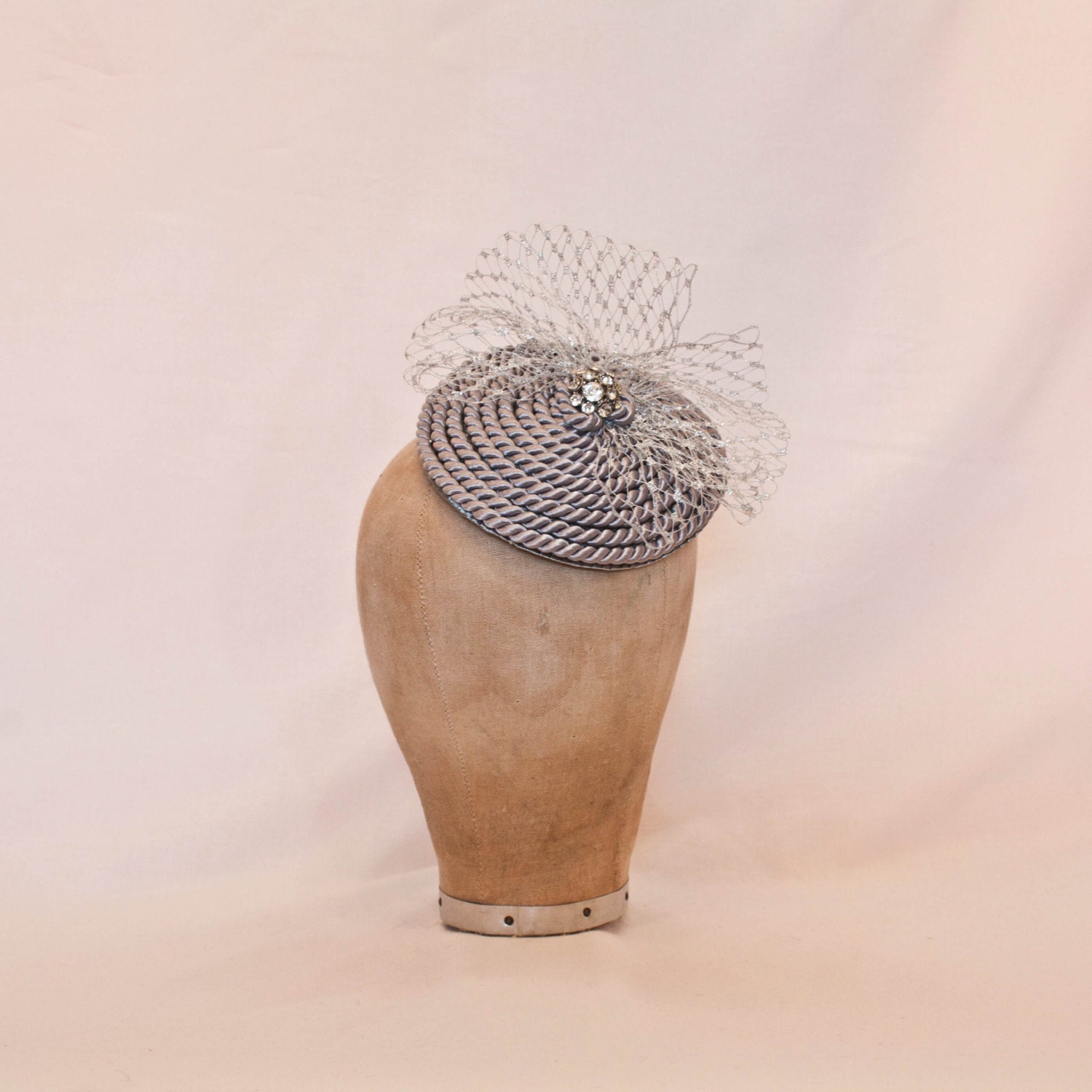 Handmade silver cord coil fascinator with silver veiling and diamanté details