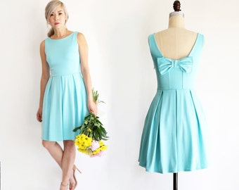 JANUARY | Aqua - seafoam teal bridesmaid dress with back bow detail. Summer aqua mint party dress with pleated skirt and pockets