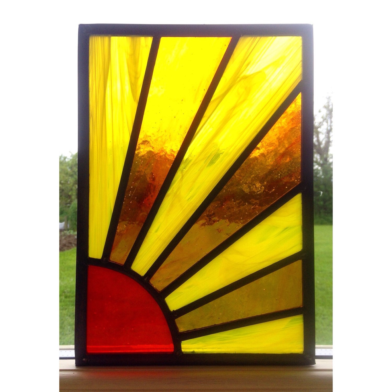 Traditionally made stained glass sunshine by MadeByAliceGlass