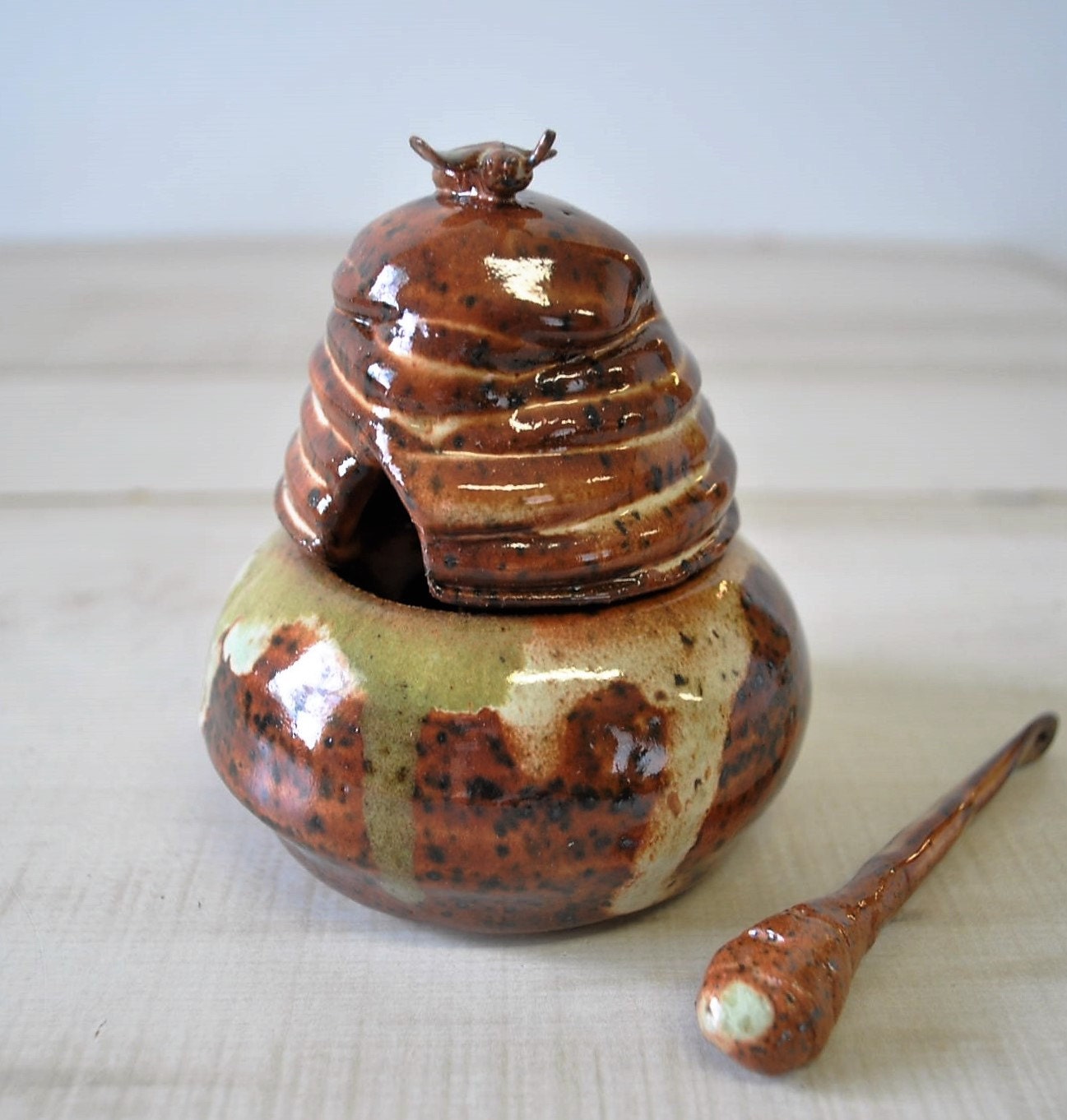 hand thrown sculpted clay honey bee pot with honey dipper