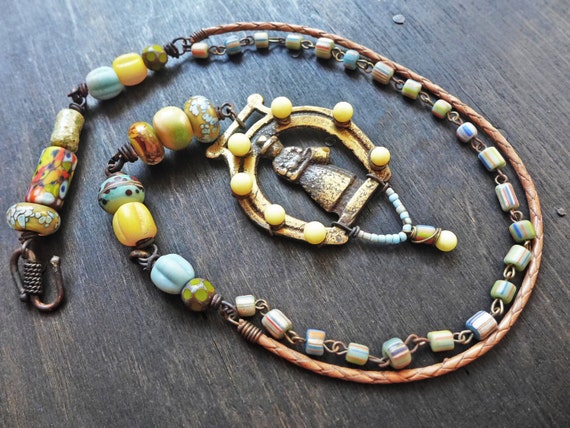 The Coming Day. Colorful necklace with chunky art beads and horse brass.