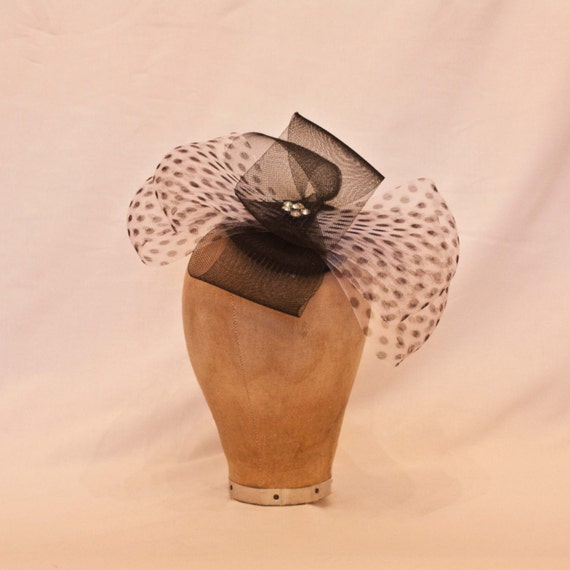 Handmade bow fascinator/ladies black and white hat decorated with polka dot net and jewel details