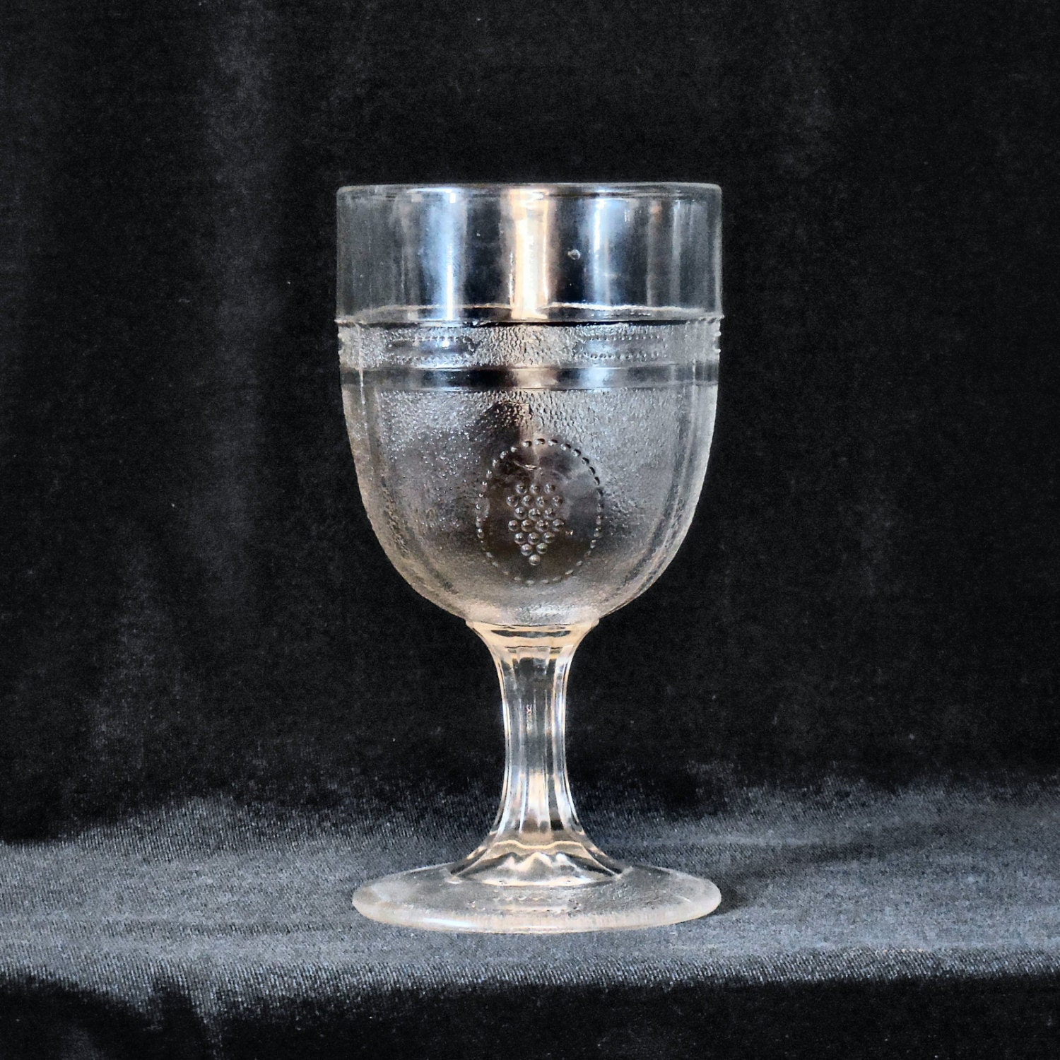 Pressed Glass Water Goblet in Beaded Grape Medallion pattern