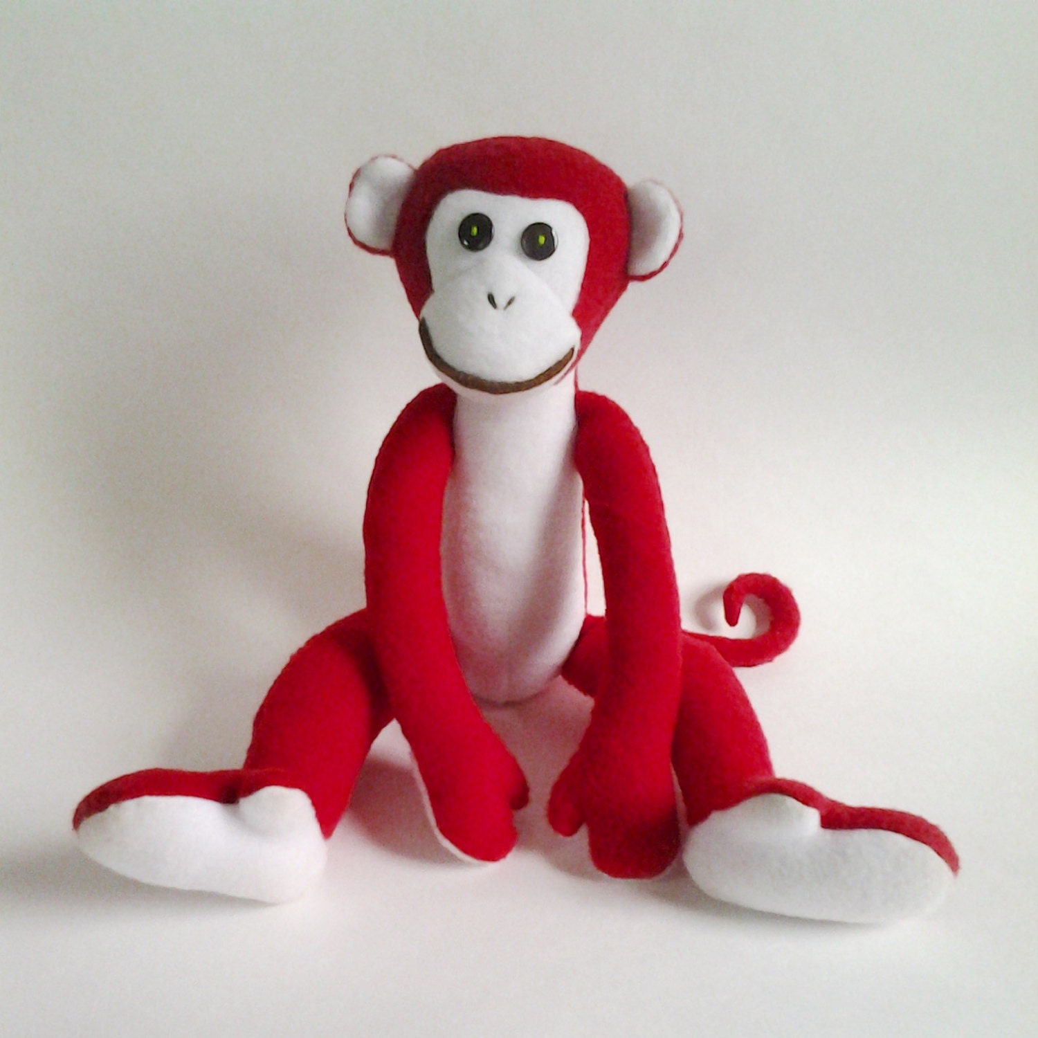 stuffed red monkey