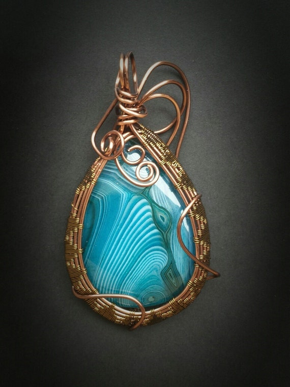Beautiful Blue swirl agate wrapped in copper wire
