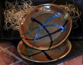 8 inch wheel thrown plates with a brown and blue glazes